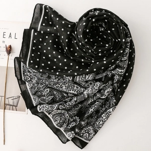 Women's scarf featuring a blend of classic white polka dots and paisley floral patterns