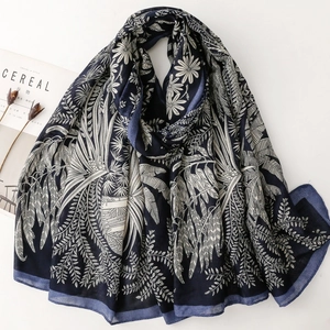 Navy blue cotton linen scarf with elegant white floral print and tropical leaf patterns