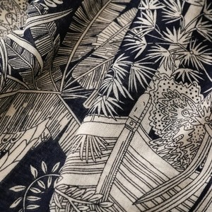 Detail of navy and beige tropical palm leaf pattern on premium linen-touch scarf fabric