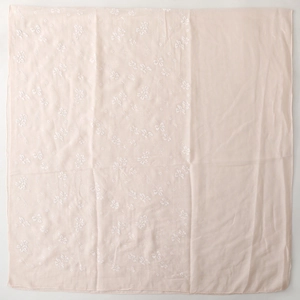 Close-up of light pink cotton linen scarf featuring white floral and butterfly embroidery
