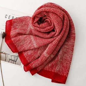 Detail of red and white checkered scarf with textured weave and pleated red edges