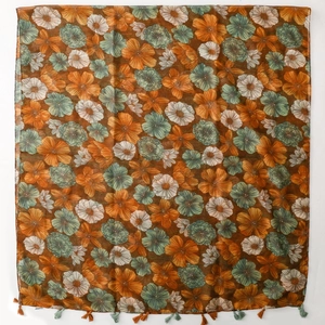 Detail shot of vintage blue floral printed scarf with light fringes and sheer fabric
