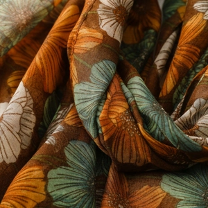Detailed macro view of vintage brown floral print fabric with high-quality linen texture