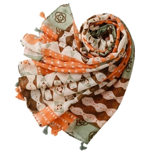 Bohemian patchwork scarf with geometric prints and tassels in orange and green