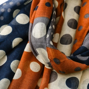 Detail shot of vintage polka dot scarf with tassels showing contrast colors and fabric texture