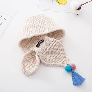 Detailed knit earflap hat for toddlers with colorful pom poms and tassels in off-white