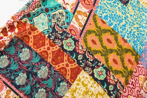 Close-up of bohemian paisley floral pattern on soft retro vintage colorful scarf fabric