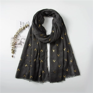 Dark grey cotton linen Christmas scarf with gold foil reindeer prints and frayed edges