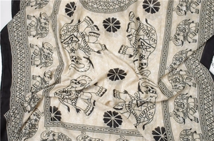 Detail view of ethnic elephant and mandala print on a beige cotton-linen shawl scarf
