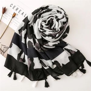 Leopard print cotton linen scarf with tassels in black and white minimalist style