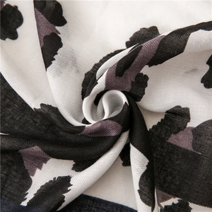 Detail of leopard print scarf showing fine herringbone weave and soft fabric layers