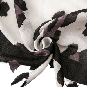 Leopard print cotton linen scarf with soft diagonal weave and elegant animal pattern