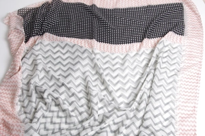 Detailed view of lightweight cotton scarf with geometric patterns and fringe edges