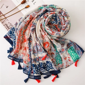 Ethnic paisley print cotton linen scarf with colorful tassels in a spiral layout