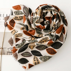 Autumn cotton linen feel scarf with leaf print and fringe edges in a heart shape