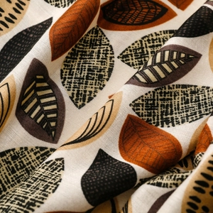 Close-up of leaf print cotton linen scarf showing fabric texture and natural drape
