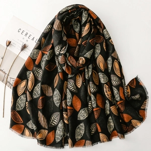 Long cotton-linen scarf with vintage botanical leaf patterns and fringed edges in black