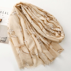 Écharpe élégante beige au toucher lin avec motifs nœuds et bords effilochés doux
