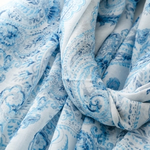 Detailed close-up of blue paisley pattern on soft cotton-linen blend scarf shawl