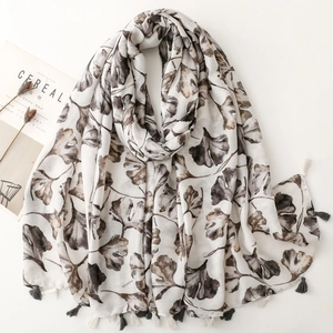 Beige cotton scarf with brown ginkgo leaf print and fringed edges for women