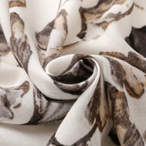 Detailed macro shot of fine ginkgo leaf print fabric with light and breathable texture