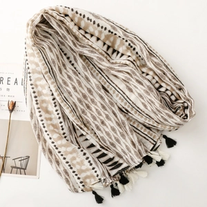 Detail of geometric pattern shawl with rustic tassels and a Nordic minimalist design