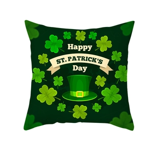 Close-up of St. Patrick's Day pillow cover with green hat and shamrock printing