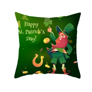 Macro view of St. Patrick's Day cushion cover with leprechaun and shamrock prints