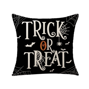 Halloween pillow case featuring Trick or Treat text with pumpkin and spider web motifs