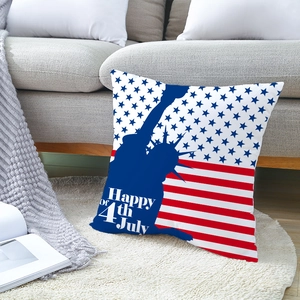 Independence Day throw pillow with Statue of Liberty and stars on a soft sofa