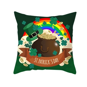 Macro detail of St. Patrick's Day pillowcase with shamrocks, rainbow, and gold coins