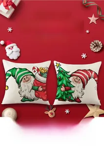 Close-up of festive red Christmas pillow covers with gnome and holiday gift patterns