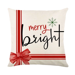 Christmas pillow cover with Merry Bright lettering and festive red ribbon on ivory fabric