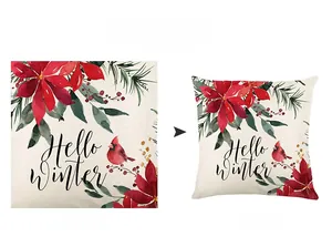 Detail of Christmas pillowcase showing red cardinal and poinsettia with Hello Winter text