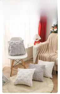 Detail of plush Christmas pillow covers featuring 3D geometric embroidered velvet texture