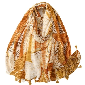 Ethnic bohemian scarf with yellow palm leaf print and decorative tassel fringe trim