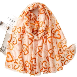 Soft cotton-linen scarf featuring warm orange hand-drawn heart prints for women