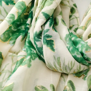 Detailed view of leaf pattern and gold foil prints on cotton-linen feel scarf shawl