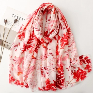 Detail of pink cotton-feel scarf with red floral leaves and gold foil leaf print