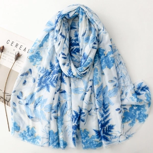 White cotton linen feel scarf with lush navy blue leaf print and golden foil accents