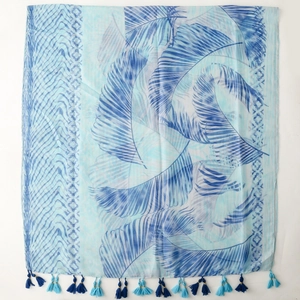 Close-up of tropical palm leaf print scarf with two-tone blue tassel fringe detail
