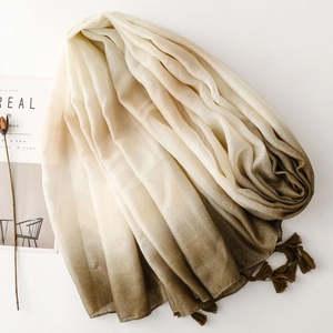 Elegant gradient linen-feel scarf with metallic threads and fringe on white background
