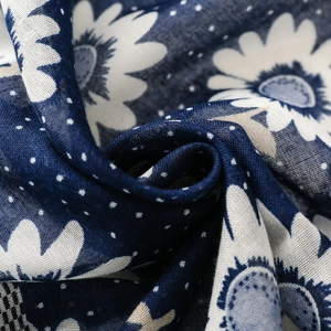 Detail shot of navy blue sunflower scarf fabric showing texture and floral print