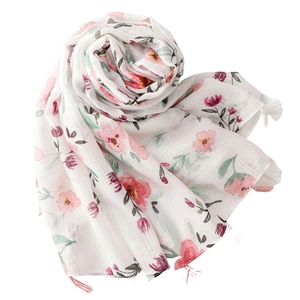 Floral cotton linen scarf with silver silk, flower print, and tassels on white background