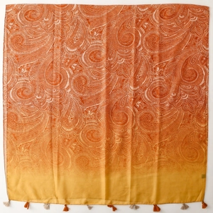 Bohemian paisley shawl with orange gradient and delicate fringe tassels on white background