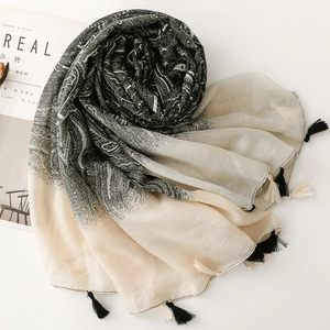 Close-up of Bohemian Paisley scarf with gradient patterns and tassel details