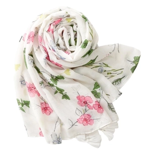 White floral scarf with pink and blue blossoms featuring soft fringe and herringbone weave