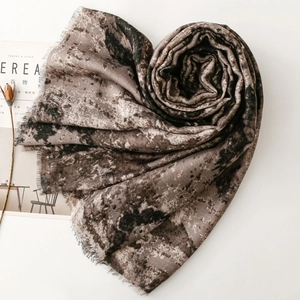 Vintage tie-dye marble print scarf with tassel edge arranged in heart shape