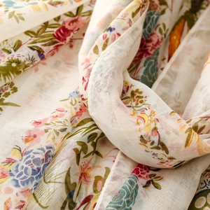 Macro detail of bohemian floral print scarf showing soft texture and fabric weaving
