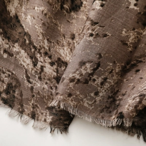 Detailed view of vintage ethnic scarf showing marble print and soft fringe edges